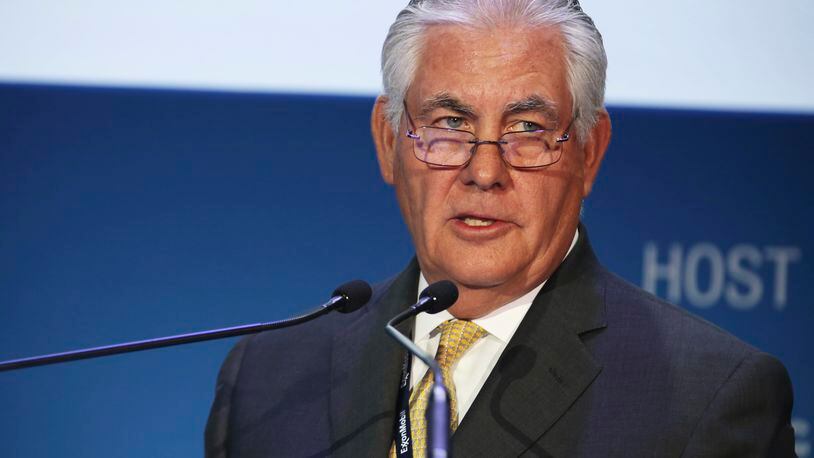 FILE - In this Nov. 7, 2016, file photo, ExxonMobil CEO and chairman Rex W. Tillerson gives a speech at the annual Abu Dhabi International Petroleum Exhibition & Conference in Abu Dhabi, United Arab Emirates. President-elect Donald Trump and his pick for secretary of state, Tillerson, have much in common. Both are wealthy, long-time business leaders with broad international interests. But they’ve taken far different approaches to preparing for government service. Tillerson has severed his business ties. Trump has not. (AP Photo/Jon Gambrell, File)