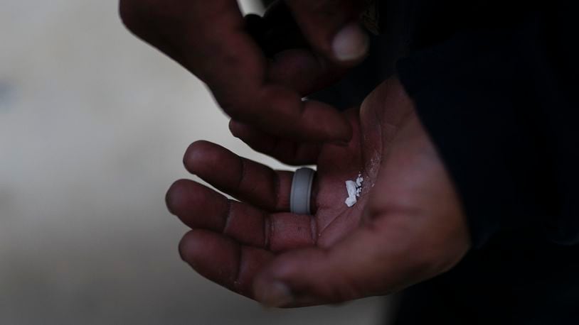 A drug user holds pieces of fentanyl. Use of the powerful synthetic opioid that is cheap to produce and is often sold as is or laced in other drugs, exploded in the past few years. Fentanyl is 50 times more potent than heroin, and even a small dose can be fatal. AP FILE