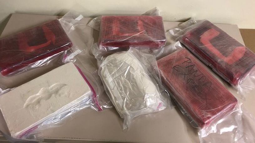 Authorities seized 12 pounds of suspected heroin following a longterm drug trafficking investigation in the Miami Valley.
