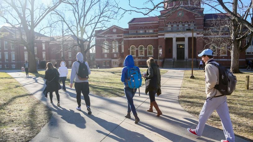 Students walk through the campus of Miami University in Oxford on Feb. 15. GREG LYNCH / STAFF