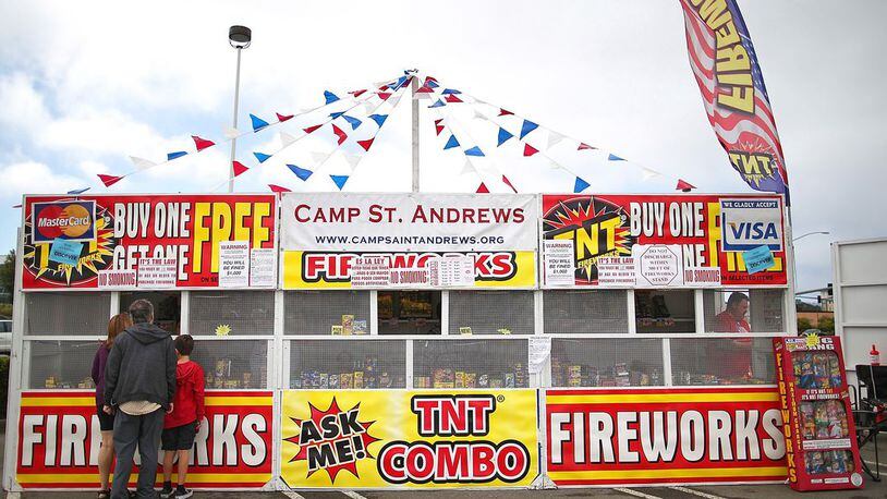 Customers shop for fireworks at the Camp St. Andrews fireworks stand on July 3, 2014 in San Bruno, California.