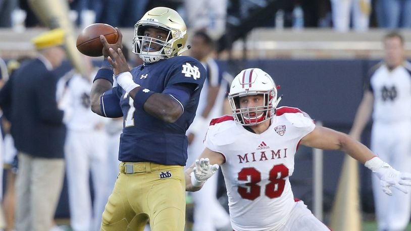 Notre Dame quarterback Brandon Wimbush drops back to pass with pressure from Miami linebacker Brad Koenig during a nonconference game Sept. 30, 2017, in South Bend, Ind. CHARLES REX ARBOGAST/ASSOCIATED PRESS