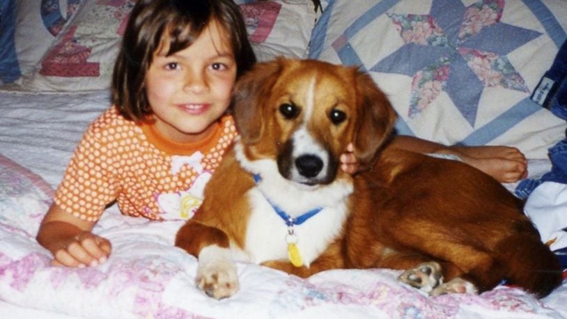 A young Jordan with her dog, Lucy. KARIN SPICER/CONTRIBUTED
