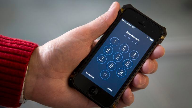 This Feb. 17, 2016, file photo shows an iPhone. The dispute over whether Apple must help the FBI hack into a terror suspect's iPhone is about to play out in a Southern California courtroom.