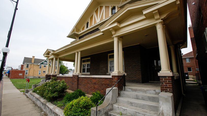 Hamilton residents hope to save attractive house in Main Street business district but developers want to tear it down to make way for apartments. NICK GRAHAM / STAFF