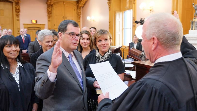 Butler County Area I Court Judge Rob Lyons administers the oath of office to Ohio Rep. George Lang, R-West Chester Twp., who on Wednesday became the representative for the 52nd Ohio House District. CONTRIBUTED
