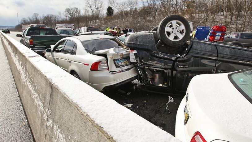 Emergency crews respond to Interstate 75 South near the Middletown exit for a crash involving more than 30 vehicles Monday, Jan. 21, 2013. Morning weather conditions are believed to have contributed to the crash.