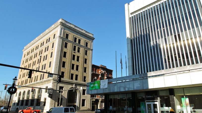 The former First National Bank Building at 2 N. Main St., at left, that was donated by the city of Middletown to Cincinnati State in 2012 is the focus of a controversy with Art Central Foundation. Cincinati State had planned to transfer the building to the local nonprofit for redevelopment. However, city officials objected saying they wanted the property back from the college for redevelopment. City and Art Central Foundation officials are discussing a possible resolution. FILE PHOTO