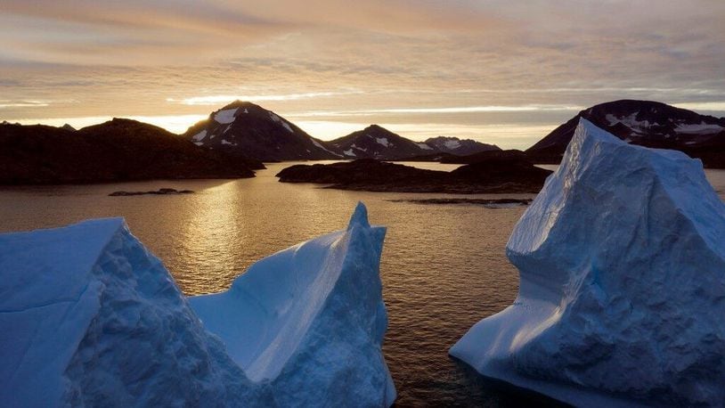 An aerial view of large Icebergs floating as the sun rises near Kulusuk, Greenland, early Friday, Aug. 16, 2019.