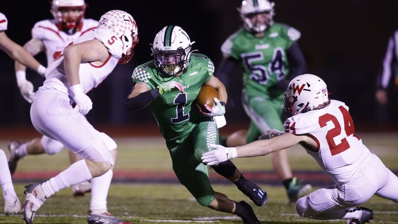 Badin's Carter Russo carries the ball during their 16-9 win over Wapakoneta in the Division III Regional Semifinal football game Friday, Nov. 11, 2022 at Trotwood-Madison High School. NICK GRAHAM/STAFF