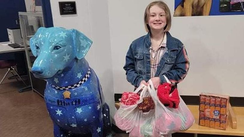 Abby Tucker, 10, a fifth-grader at Mayfield Elementary School in Middletown, used some of her Christmas money to buy blankets and food for the homeless. She dropped the items off this week at the Middletown police department. SUBMITTED PHOTO