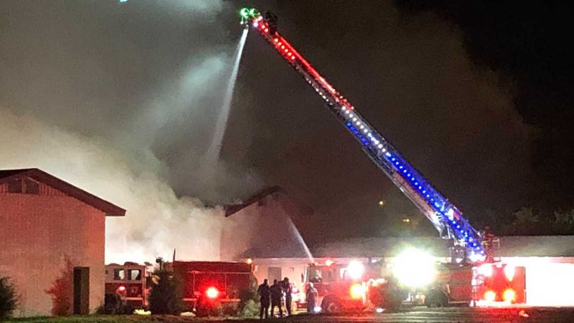 A fire at the vacant Carrousel Inn & Suites building on Reading Rd. in Sycamore Township raged for hours while firefighters from multiple different agencies were called in to help. EMILY GIBNEY / CONTRIBUTED
