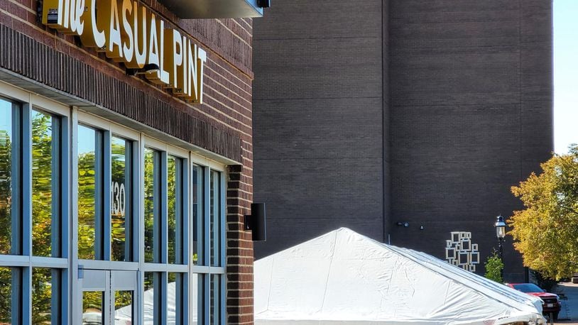 The Casual Pint Hamilton, 130 Riverfront Plaza, has opened a tent to expand its capacity as a way to serve customers through the winter. NICK GRAHAM/STAFF