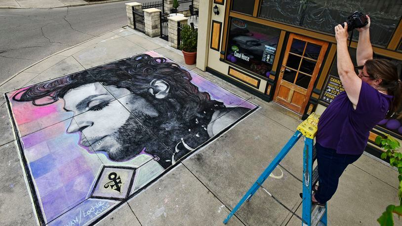 In 2016, artists Mark Hanavan of Middletown and Paul Loehle of Cincinnati created a chalk drawing of Prince (pictured) in front of The Canal House Bar & Grille during the “Chalk It Up” event. NICK GRAHAM/STAFF