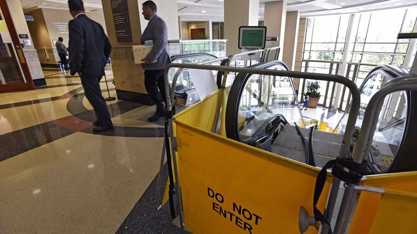 The escalator in the lobby of the Government Services Center that is stopped more than moving is on the $3.6 million capital improvement list for 2020 that the Butler County commissioners will consider. The escalator in the lobby of the Government Services Center has not been fully operational since May because a part has to be made to fix it. The up escalator is functional, but if you want to go down you have to either take the elevator or the stairs. The escalator is original to the building which opened in 1999 and it is getting more costly to maintain. NICK GRAHAM/STAFF
