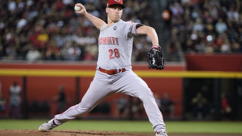 PHOENIX, ARIZONA - SEPTEMBER 14: Anthony DeSclafani #28 of the Cincinnati Reds delivers a pitch in the first inning of the MLB game against the Arizona Diamondbacks at Chase Field on September 14, 2019 in Phoenix, Arizona. (Photo by Jennifer Stewart/Getty Images)