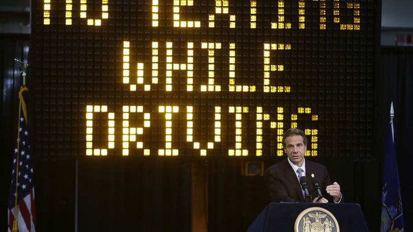 In this May 31, 2013, file photo, New York Gov. Andrew Cuomo speaks during a news conference to announce the increase in penalties for texting while driving in New York. New York state is set to study the use of a device known as the textalyzer that would allow police to determine whether a motorist involved in a serious crash was texting while driving. Cuomo announced July 26, that he would direct the Governor s Traffic Safety Committee to examine the technology, as well as the privacy and constitutional questions it could raise. (AP Photo/Frank Franklin II, File)