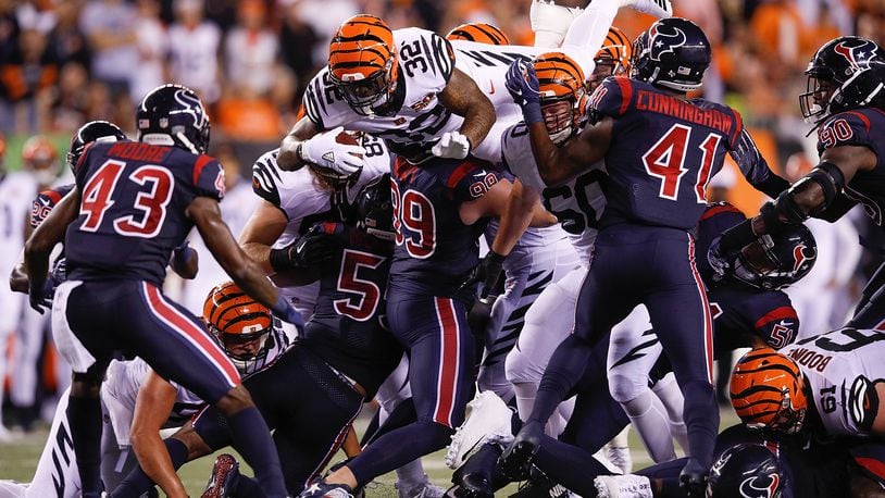 CINCINNATI, OH - SEPTEMBER 14:  Jeremy Hill #32 of the Cincinnati Bengals jumps over the pile for a first down against the Houston Texans during the second half at Paul Brown Stadium on September 14, 2017 in Cincinnati, Ohio.  (Photo by Joe Robbins/Getty Images)