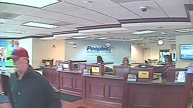 A surveillance camera took a photo of the man believed to have robbed the Peoples Bank branch in Carlisle on March 14, 2019. Carlisle police have identified him as Mark Lunsford, 58, of Hamilton. He is being held on a felony theft/receiving stolen property charge in Dearborn County, Ind. Lunsford is also a person of interest in two 2016 bank robberies in Franklin and Springboro. CONTRIBUTED
