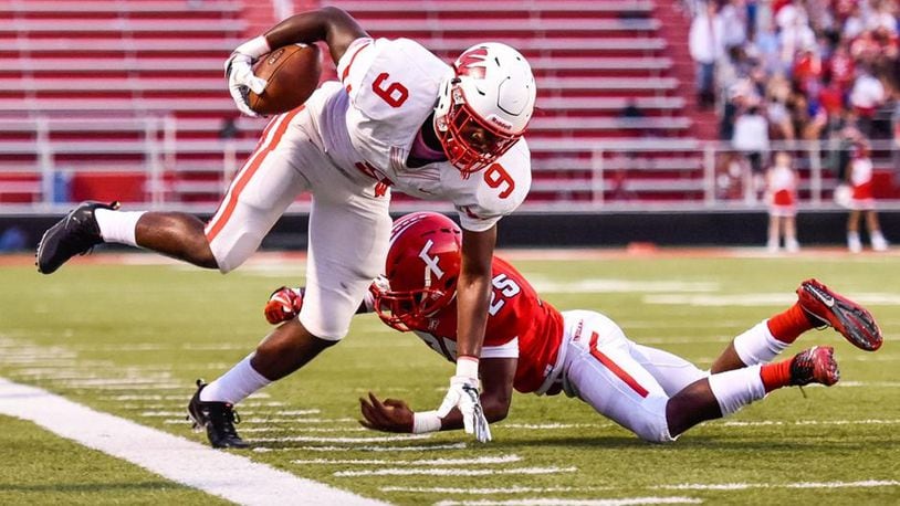 Fairfield’s Corey Smith (25) goes after Lakota West’s D.J. Christon on the sideline during Friday night’s 37-3 FHS victory at Fairfield Stadium. NICK GRAHAM/STAFF