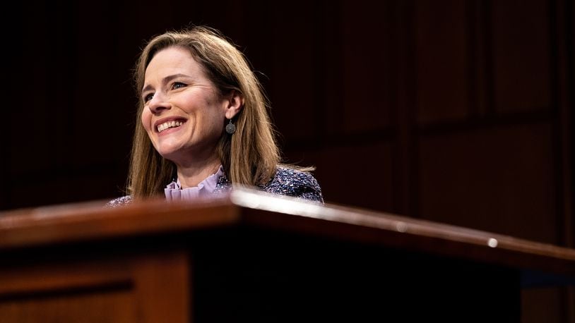 Judge Amy Coney Barrett was confirmed on Monday to the Supreme Court, capping a lightning-fast Senate approval that handed President Trump a victory ahead of the election and promised to tip the court to the right for years to come. (Erin Schaff/The New York Times)