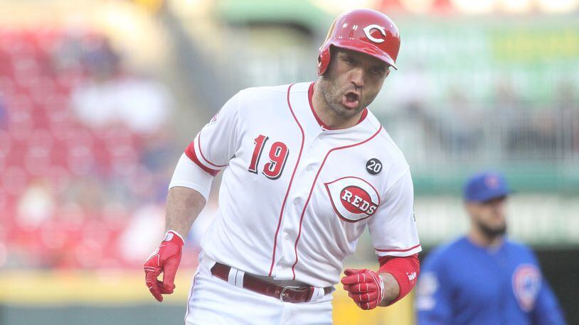 The Reds’ Joey Votto rounds the bases after a home run on Tuesday, May 14, 2019, at Great American Ball Park in Cincinnati. David Jablonski/Staff