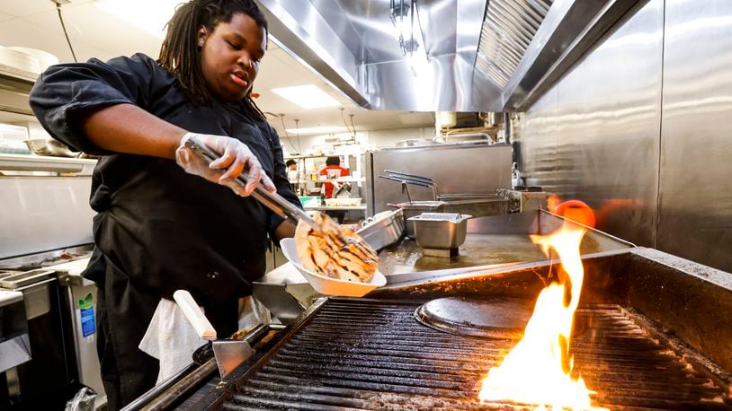 Knowledge Turner prepares food at Tano Bistro Thursday, April 21, 2022 in Hamilton. Tano is one of many restaurants that have limited days open due to staffing issues. NICK GRAHAM/STAFF