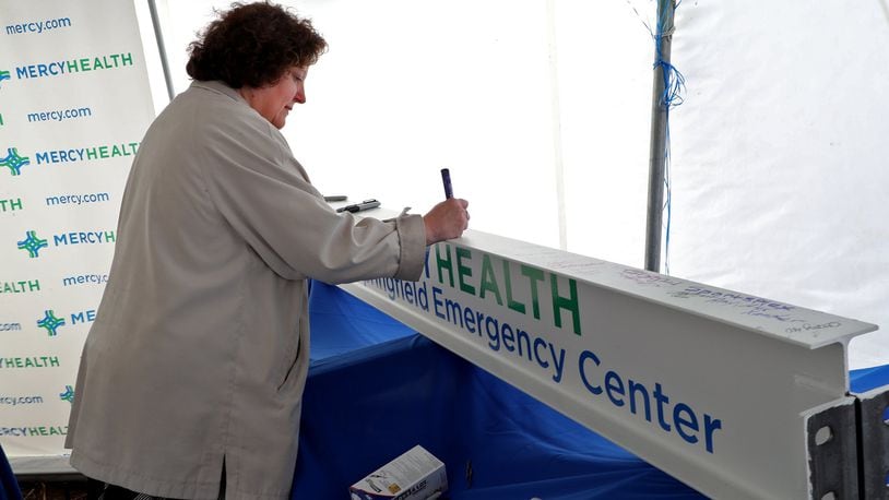 Cheryl Haines signs a ceremonial steel beam during the ground breaking ceremony in October for the new Mercy Health Dayton-Springfield Emergency Center.