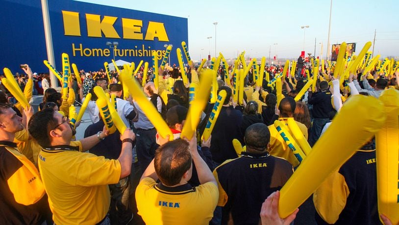IKEA employees wave "Thunder Sticks" as they gather in front of the store during opening celebrations Wednesday, March 12, 2008. Staff photo by Greg Lynch