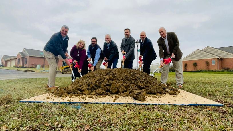 Officials with the city of Hamilton and Berkeley Square pose for a ceremonial groundbreaking photo as the senior living facility embarks on its 15th expansion phase. MICHAEL D. PITMAN/STAFF 