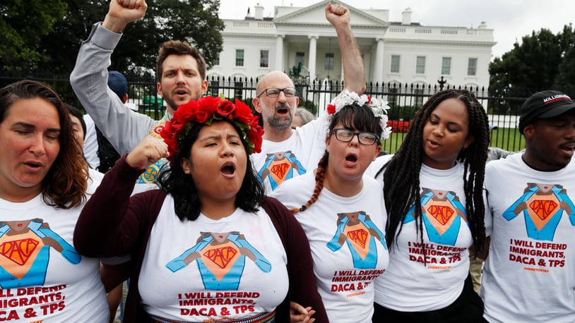 Wendolynn Perez, 23, second from left, a DACA recipient who is now a permanent resident and is originally from Peru, chants with other supporters of immigration reform, Tuesday, Aug. 15, 2017, at the White House in Washington. The protesters want to preserve the Obama administration program known as Deferred Action for Childhood Arrivals, or DACA. The Trump administration has said it still has not decided the program's fate.(AP Photo/Jacquelyn Martin)
