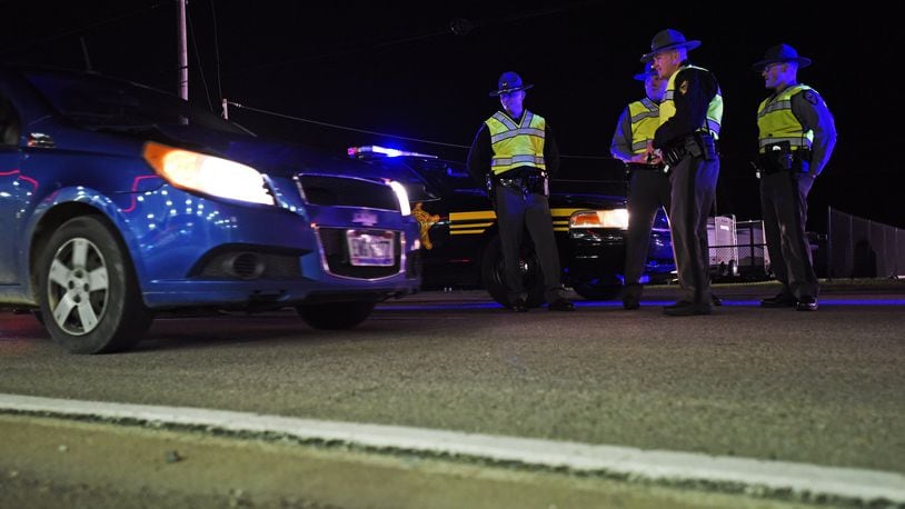 The Butler County OVI Task Force at a sobriety checkpoint to check for impaired drivers last year along US 127 in New Miami. NICK GRAHAM/STAFF