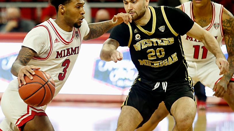 Miami Redhawks guard Dae Dae Grant drives on Western Michigan guard William Boyer-Richard during Mid-American Conference play at Millett Hall in Oxford Jan. 30, 2021. Contributed photo by E.L. Hubbard
