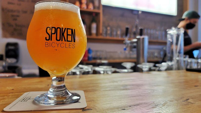 Spoken Bicycles on Central Ave. in Middletown is a full service bike shop offering sales, service, parts and accessories but is also a craft beer and cocktail bar with rotating taps. NICK GRAHAM / STAFF