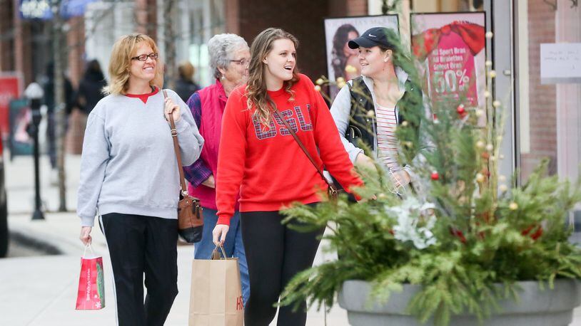 Shoppers walk through the streets at Liberty Center as they shop on Black Friday, Nov. 25, 2016. This weekend’s shopping could be the heaviest of the season. GREG LYNCH / STAFF