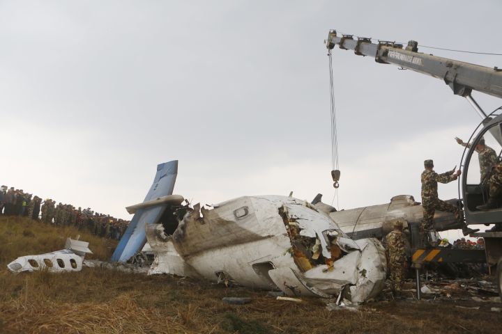 Photos: Kathmandu plane crash kills dozens, Nepal police say