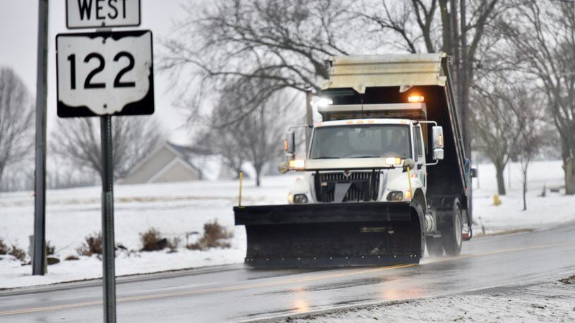 Salt trucks and snow plows worked on roads as a wintry mix fell on the area on Monday, Jan. 8, 2018. NICK GRAHAM / STAFF