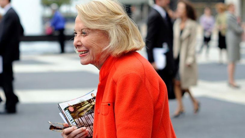 FILE- In this Aug. 9, 2009, file photo, Liz Smith leaves the Celebration of Life Memorial ceremony for Walter Cronkite at Avery Fisher Hall in New York. Smith, a gossip columnist whose mixture of banter, barbs, and bon mots about the glitterati helped her climb the A-list as high as many of the celebrities she covered, has died. Literary agent Joni Evans told The Associated Press she died in New York on Sunday, Nov. 12, 2017. She was 94. (AP Photo/Stephen Chernin, File)