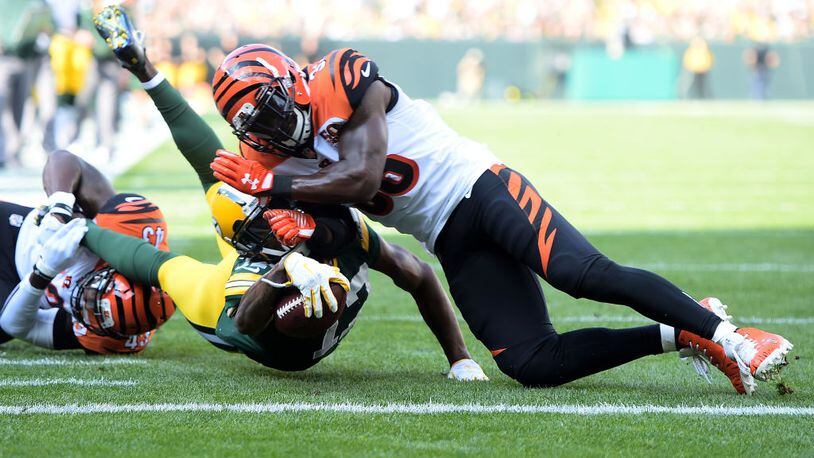 GREEN BAY, WI - SEPTEMBER 24: Davante Adams #17 of the Green Bay Packers is tackled by Shawn Williams #36 of the Cincinnati Bengals diving towards the end zone during the first quarter of their game at Lambeau Field on September 24, 2017 in Green Bay, Wisconsin. (Photo by Stacy Revere/Getty Images)