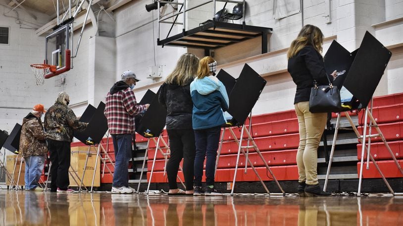 Voters cast their ballot on election day at Madison schools auxiliary gymnasium Tuesday, Nov. 3, 2020 in Madison Township. NICK GRAHAM/STAFF