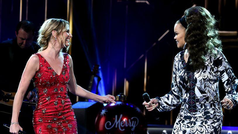 Singers Jennifer Nettles (left) and Andra Day perform during the “CMA Country Christmas” special. RICK DIAMOND/GETTY IMAGES