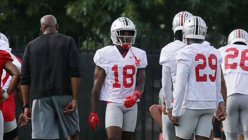 Cornerback Jyaire Brown (18), of Lakota West, warms up at the the first Ohio State practice of the season on Thursday, Aug. 4, 2022, at the Woody Hayes Athletic Center in Columbus. David Jablonski/Staff