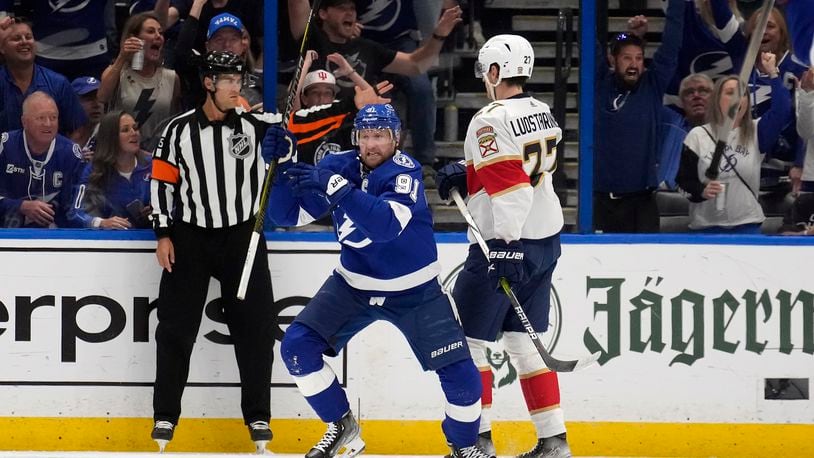 Tampa Bay Lightning center Steven Stamkos (91) celebrates his goal in front of Florida Panthers center Eetu Luostarinen (27) during the first period in Game 4 of an NHL hockey Stanley Cup first-round playoff series, Saturday, April 27, 2024, in Tampa, Fla. (AP Photo/Chris O'Meara)