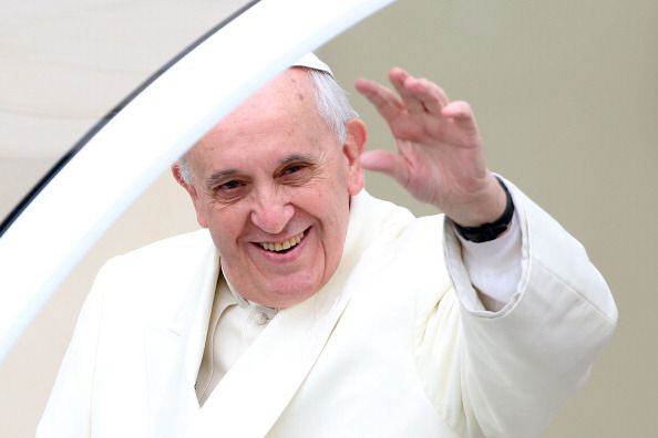 Pope Francis waves to the crowds as he arrives in St. Peter's square (January 22, 2014)
