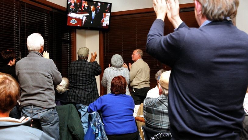 Butler County Democrats members cheer following President Barack Obama’s State of the Union 2014 address during a watch party on Jan. 28, 2014, at Champps in West Chester Twp.
