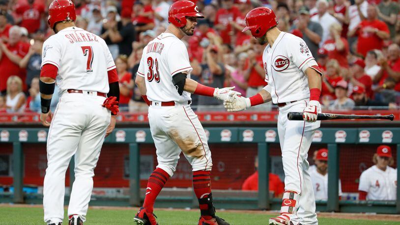 CINCINNATI, OH - JUNE 28:  Jesse Winker #33 of the Cincinnati Reds celebrates with Adam Duvall #23 after hitting a home run in the third inning against the Milwaukee Brewers at Great American Ball Park on June 28, 2018 in Cincinnati, Ohio.  (Photo by Andy Lyons/Getty Images)