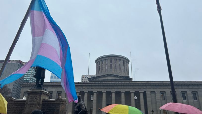 A group of protestors gathered outside the Ohio Statehouse on January 24, 2024 to voice displeasure of the Senate's likely override of Gov. Mike DeWine's veto on a bill that would bar transgender minors from undergoing gender affirming care.