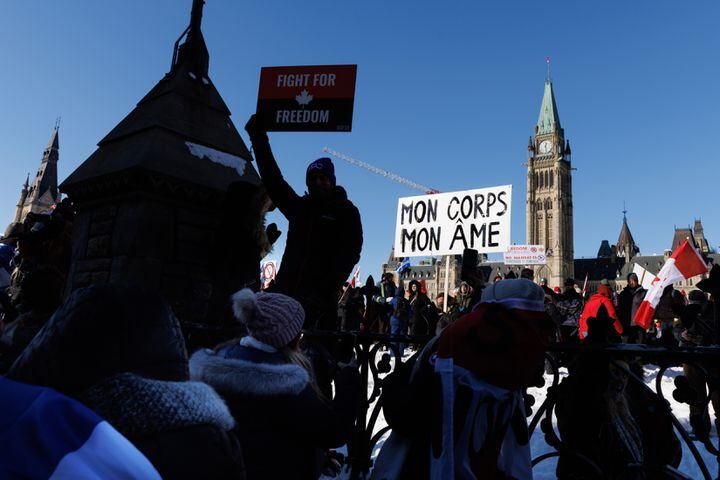 Supporters of the convoy of truckers protesting coronavirus vaccine mandates and pandemic restrictions rally on Parliament Hill in downtown Ottawa, Canada, Jan. 29, 2022. (Nasuna Stuart-Ulin/The New York Times)