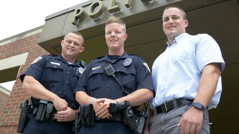 Fairfield Police Department has hired three new officers, two of whom are in their training time. Jeremiah Taylor, 33, (left) and Conner Frazier, 26, (center) are currently assigned to field training officers for the next few months, and Darin Gooch, 28, will start his police officer training program this month with the Ohio State Highway Patrol. MICHAEL D. PITMAN/STAFF