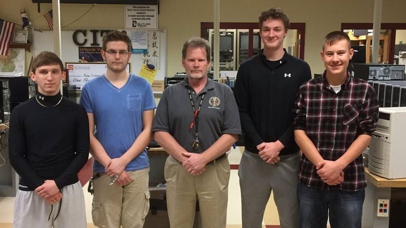 Students from Ross High School in Butler County have designed a school security cell phone app. Their team has been named one of 10 national finalists in Samsung Solve for Tomorrow contest, which will be held next month in Washington, D.C. Pictured (from left) are: Kody Bryant, Tyler West, instructor Thomas O Neill, Grant Ridge and Jacob Halm. CONTRIBUTED
